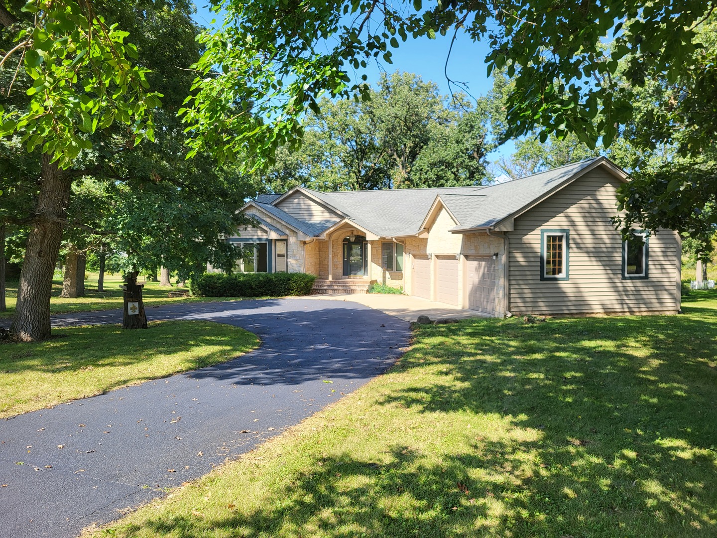 10120 East Hickory Ridge Drive Rochelle, IL 61068 - Photo 3 of 39 a view of a yard in front of house