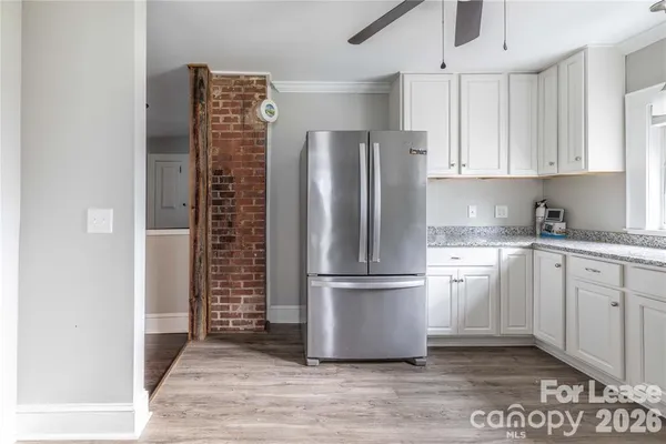 a kitchen with cabinets and stainless steel appliances