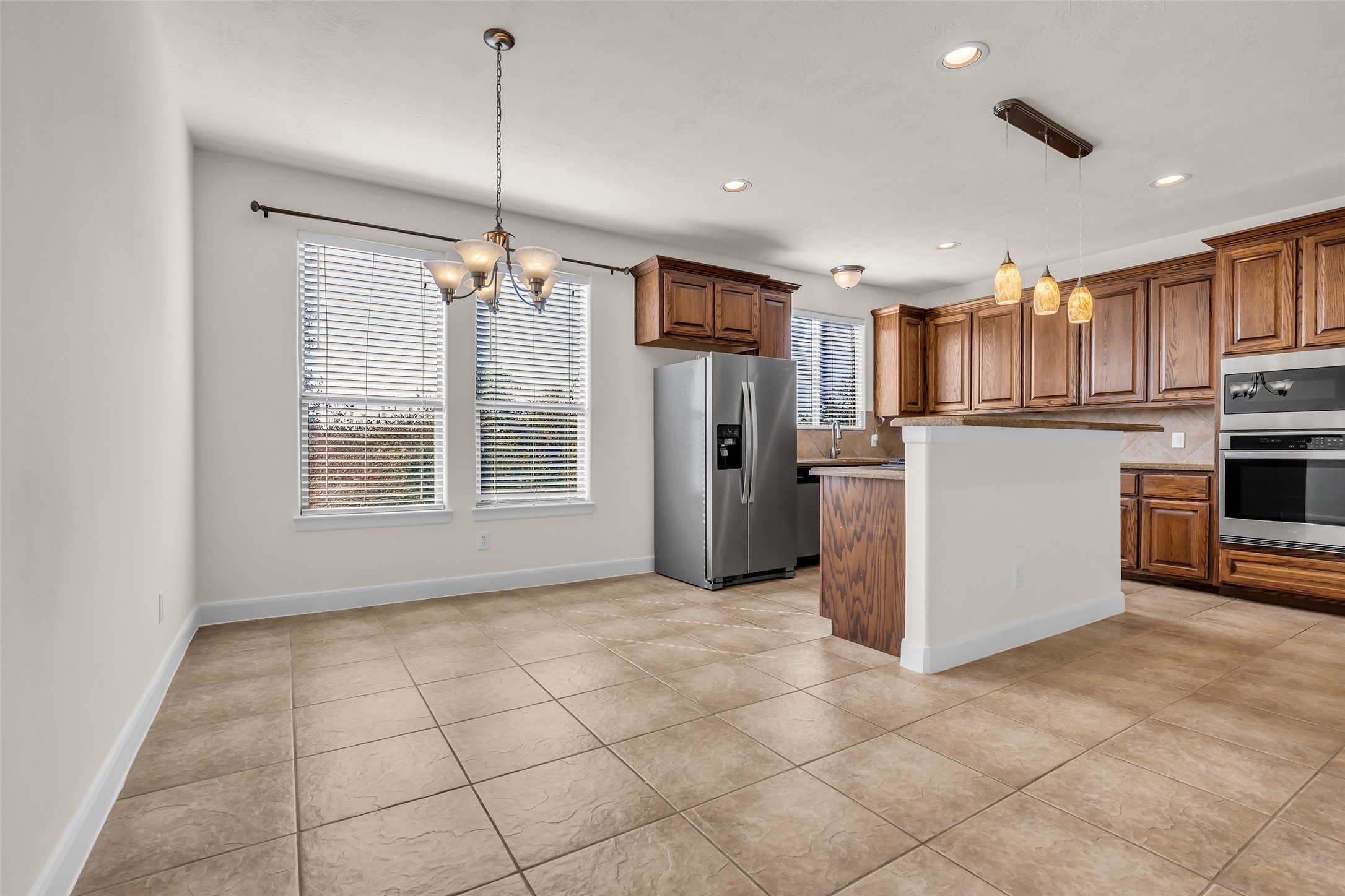 1803 Stacy Crest Houston, TX 77008 - Photo 11 of 28 Located next to the kitchen, the dining area features a tiled floor and a bright, welcoming atmosphere.