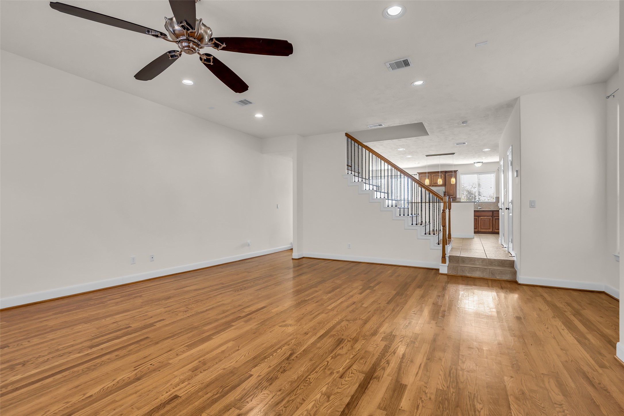 1803 Stacy Crest Houston, TX 77008 - Photo 13 of 28 It offers a clear view toward the kitchen, with the staircase positioned between the two spaces.