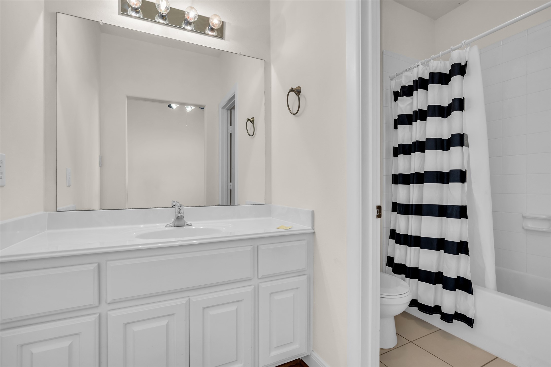 1803 Stacy Crest Houston, TX 77008 - Photo 22 of 28 The en suite bathroom includes a tub and shower combination with a single sink.