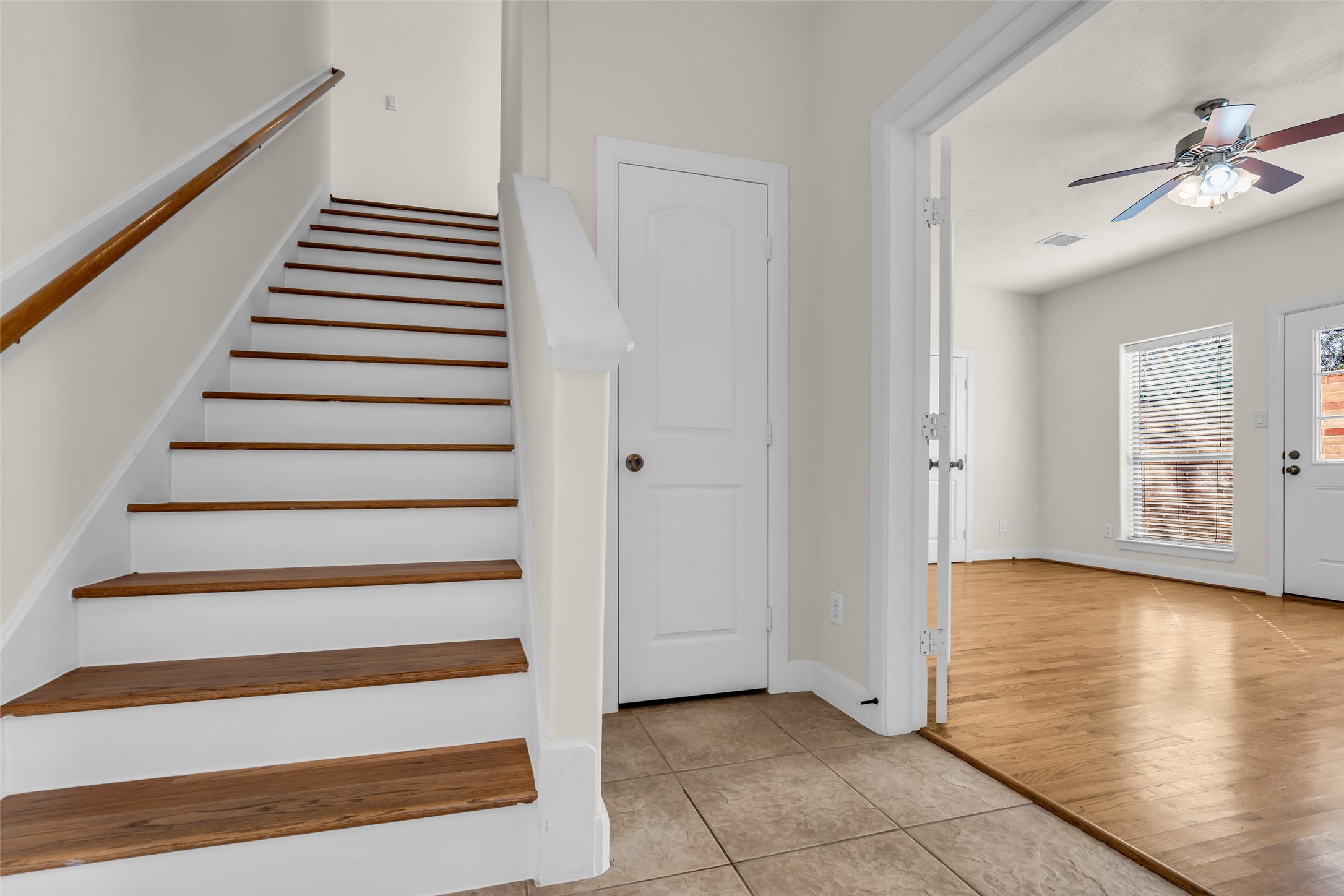 1803 Stacy Crest Houston, TX 77008 - Photo 5 of 28 The staircase leads to the second floor and includes a convenient storage space tucked neatly alongside it.