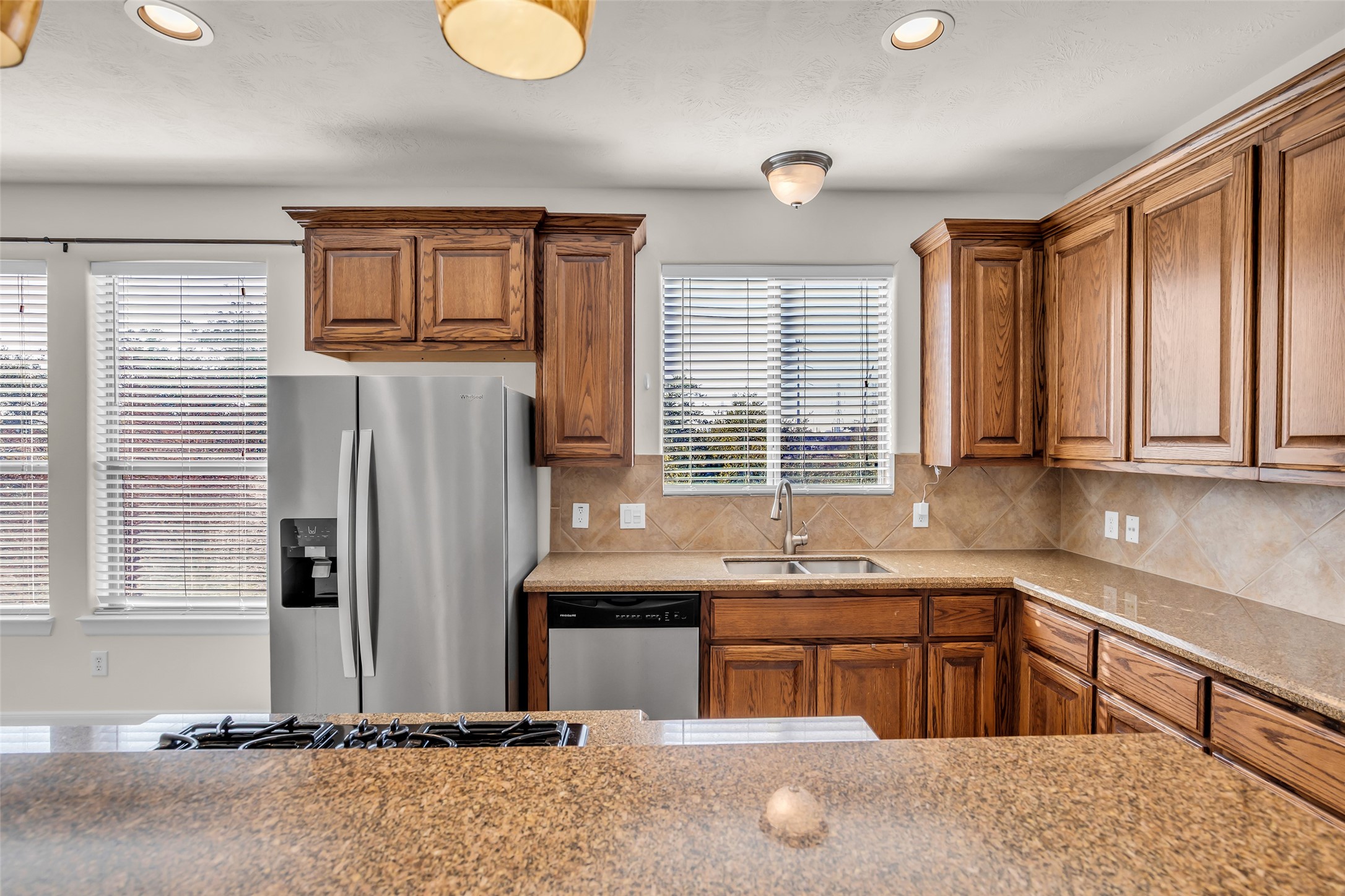 1803 Stacy Crest Houston, TX 77008 - Photo 8 of 28 This area features ample cabinet storage and windows that allow natural light to fill the space.
