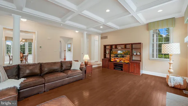 a bathroom with a granite countertop sink mirror and toilet