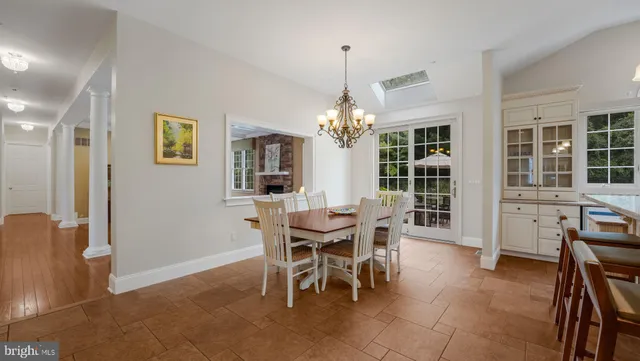 a bedroom with a bed a table and chair