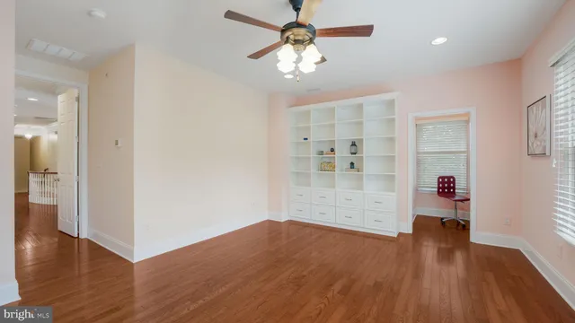 a view of a house with swimming pool and sitting area