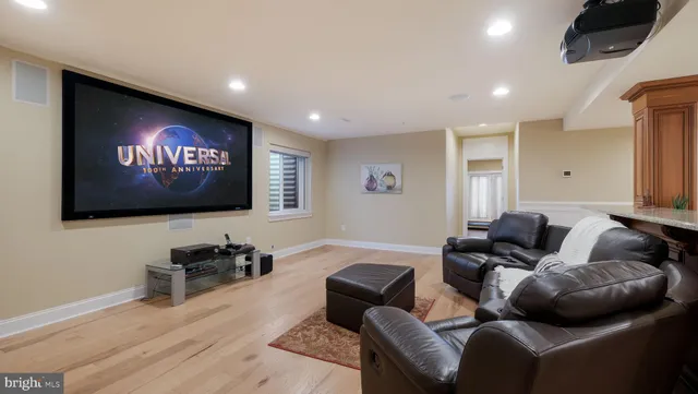 a front view of a house with a garden and trees