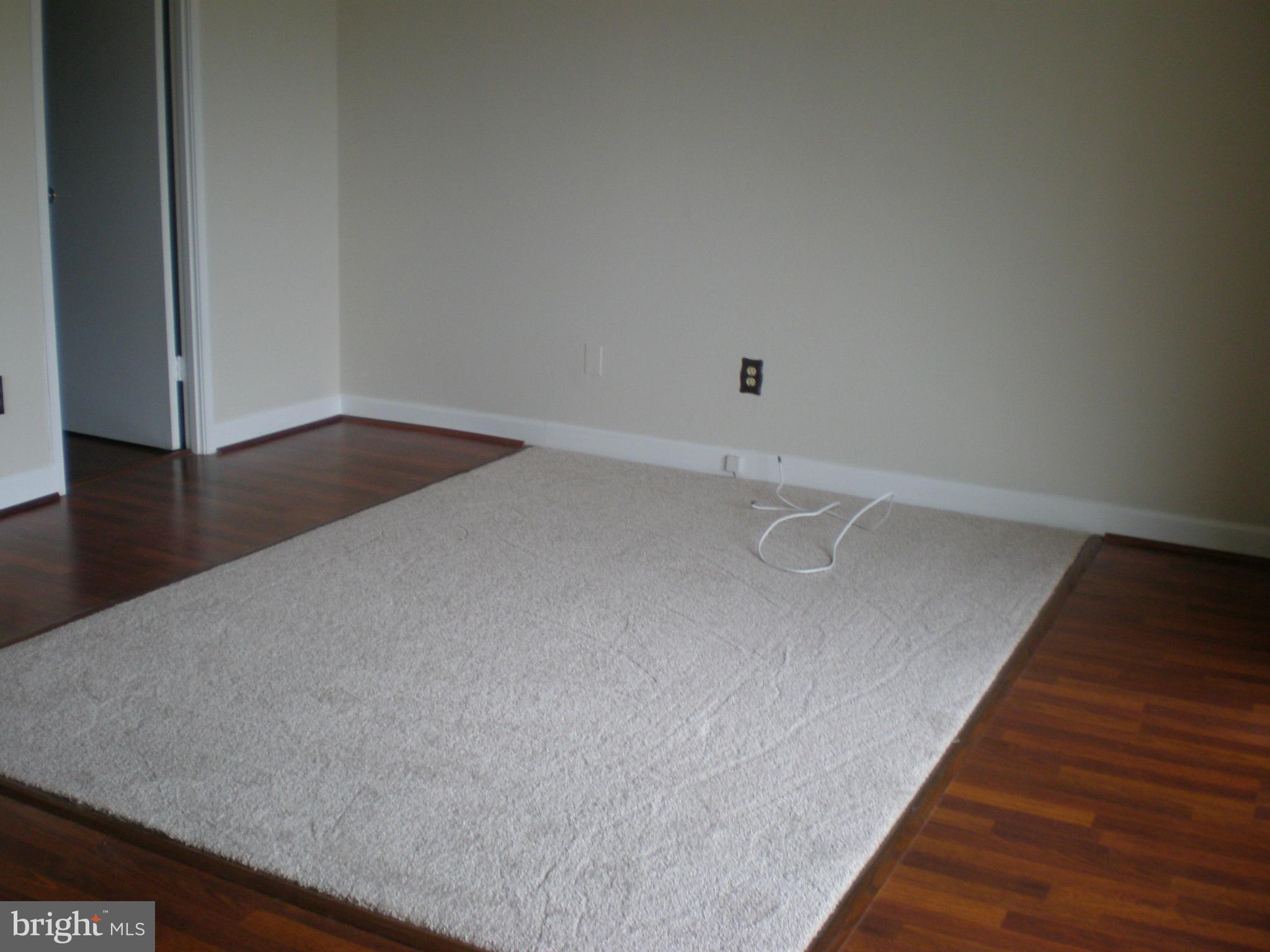 6101 Edsall Road, Unit 1412 Alexandria, VA 22304 - Photo 7 of 17 a view of a room with wooden floor