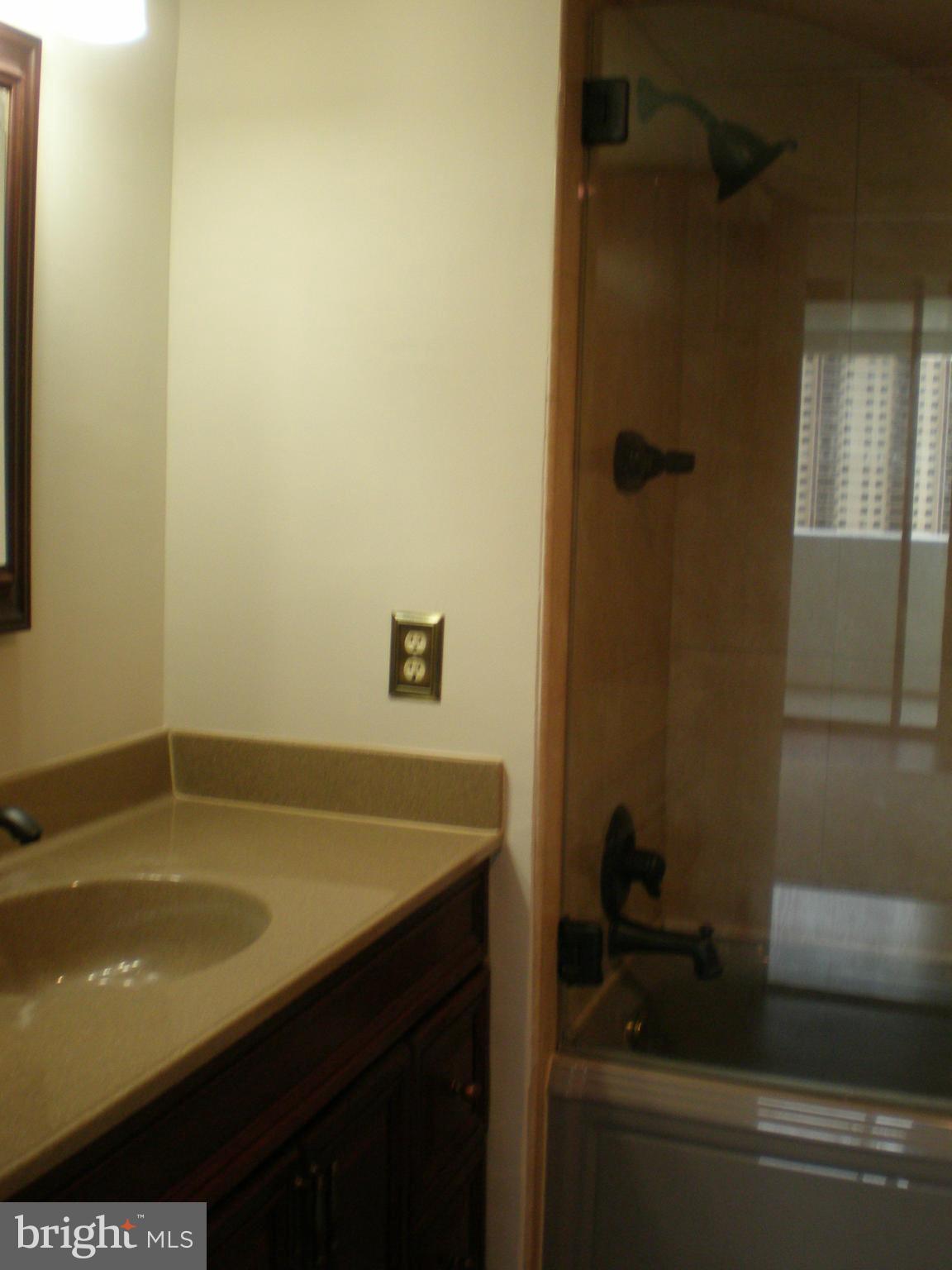 6101 Edsall Road, Unit 1412 Alexandria, VA 22304 - Photo 9 of 17 a bathroom with a sink and a shower