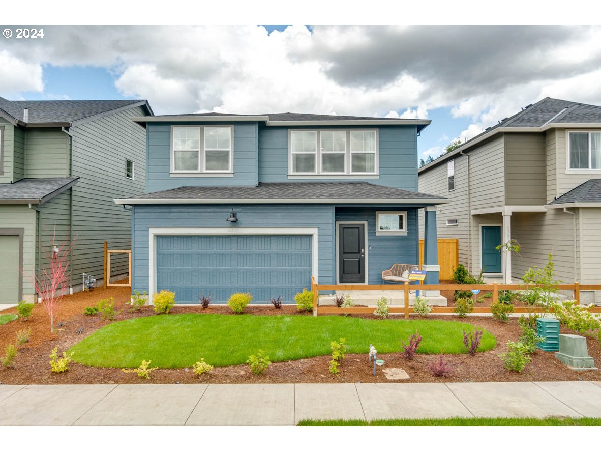 2785 V Street Springfield, OR 97477 - Photo 3 of 31 a front view of a house with garden and trees