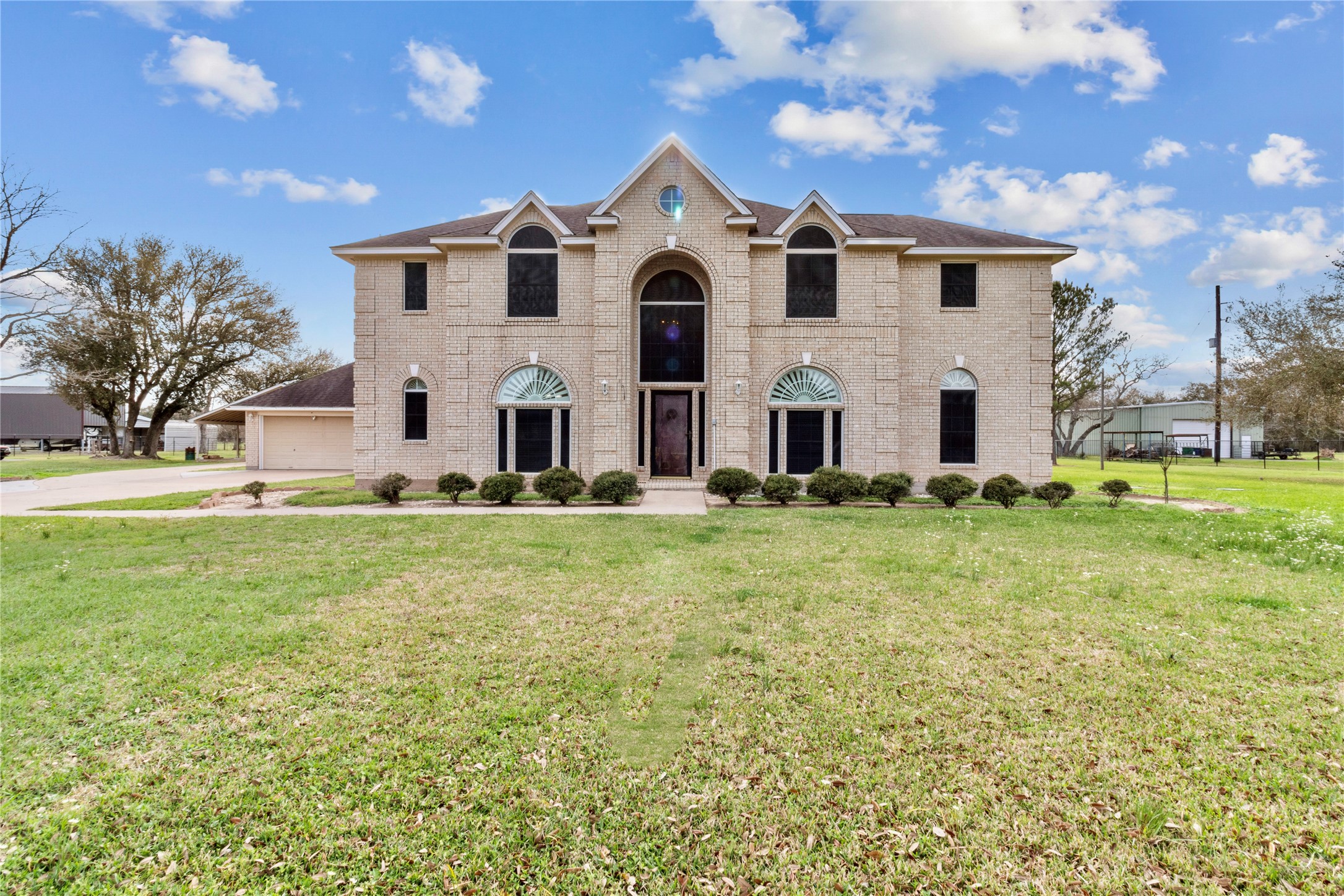 10302 Hanselman Road, Unit CR69 Manvel, TX 77578 - Photo 15 of 49 a front view of a house with a yard