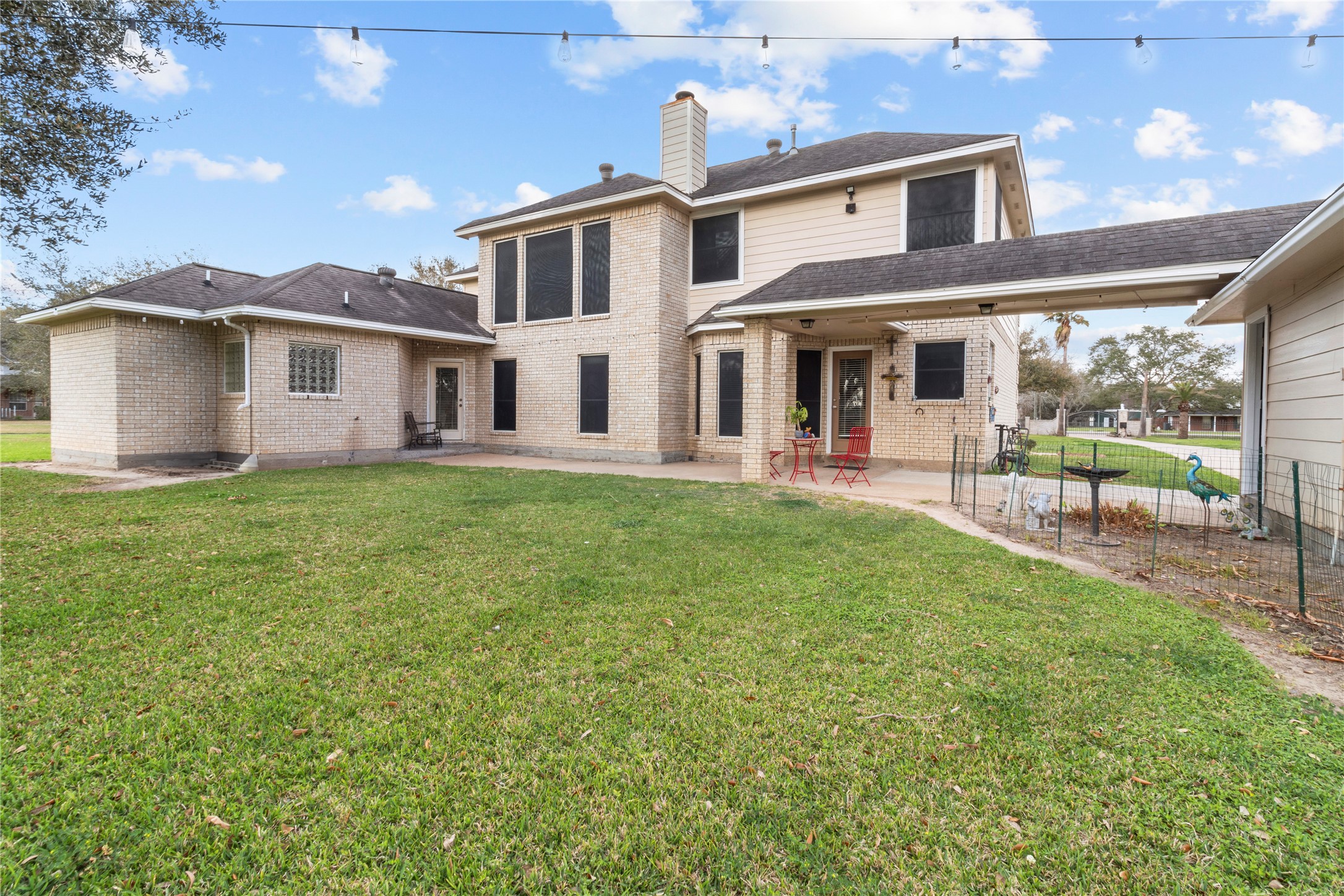 10302 Hanselman Road, Unit CR69 Manvel, TX 77578 - Photo 17 of 49 a front view of a house with a yard and porch
