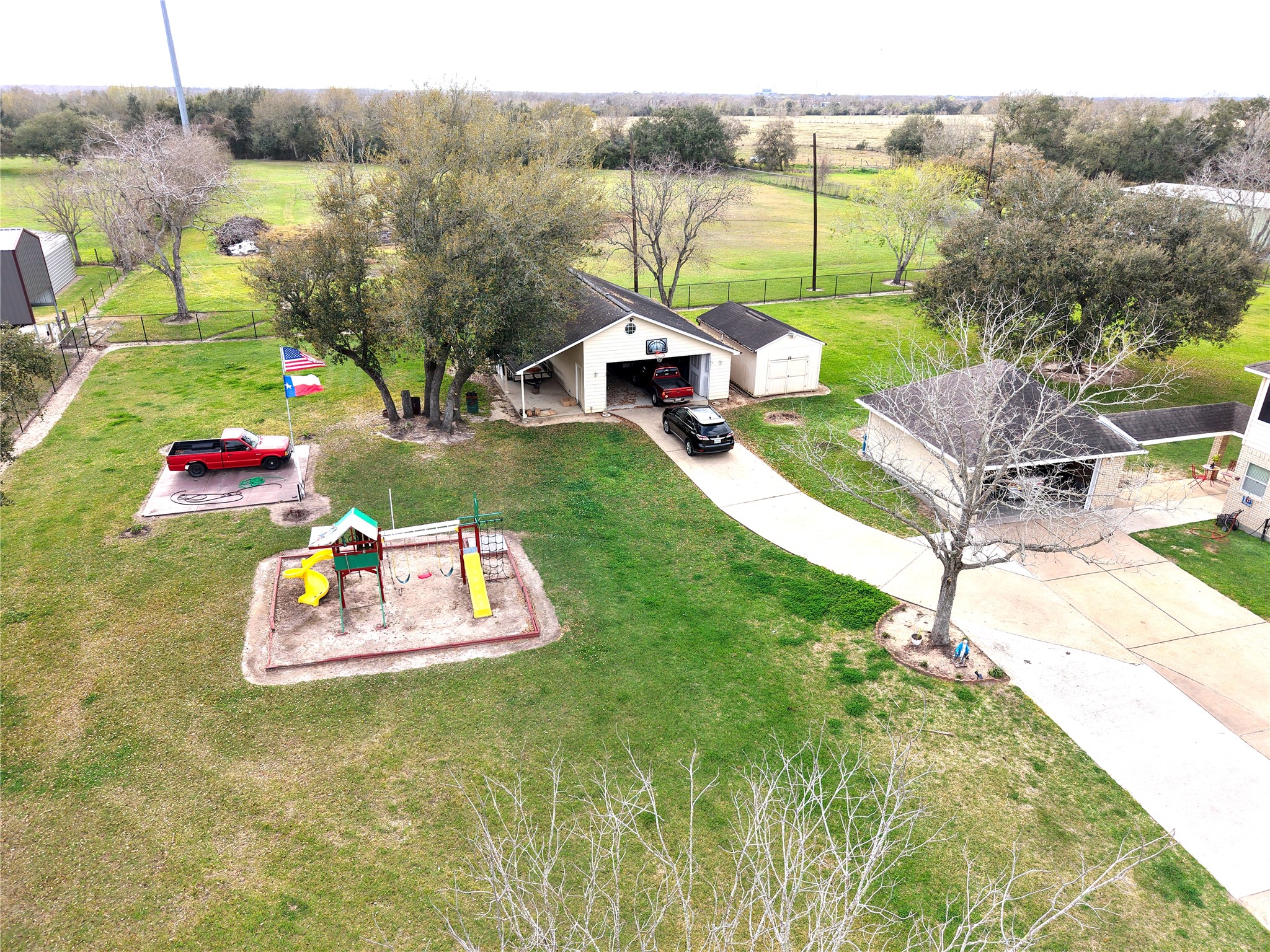 10302 Hanselman Road, Unit CR69 Manvel, TX 77578 - Photo 3 of 49 a wooden bench sitting in the middle of a park