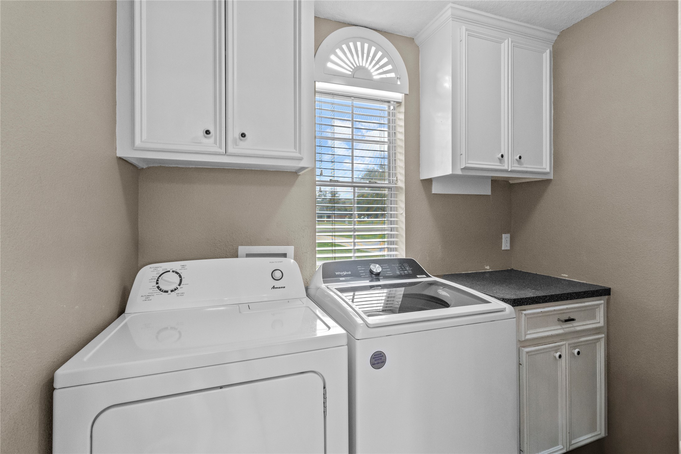 10302 Hanselman Road, Unit CR69 Manvel, TX 77578 - Photo 31 of 49 a utility room with dryer and washer