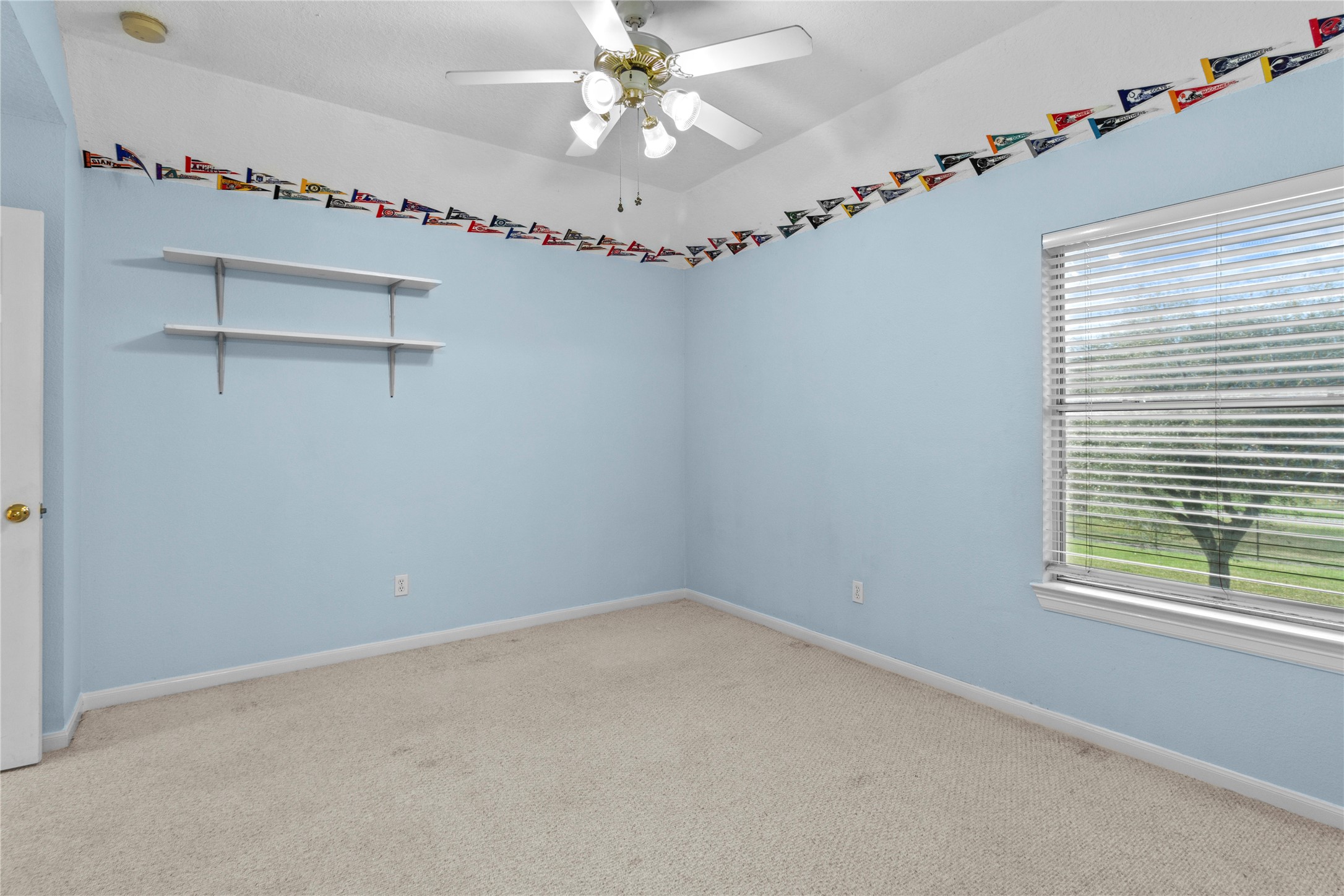 10302 Hanselman Road, Unit CR69 Manvel, TX 77578 - Photo 43 of 49 a view of a room with window and a ceiling fan