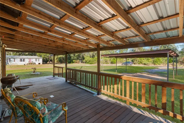 a view of a patio with wooden floor