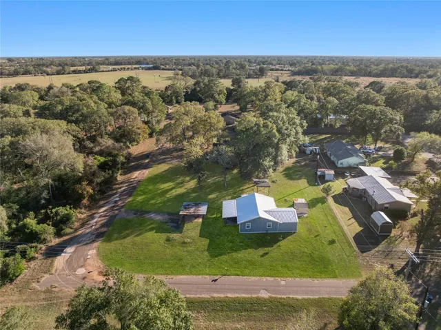 an aerial view of residential houses with outdoor space