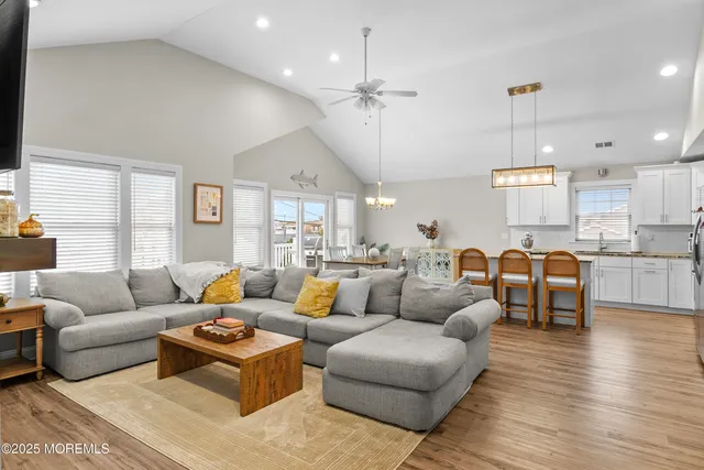 a spacious bedroom with a bed and a table in it