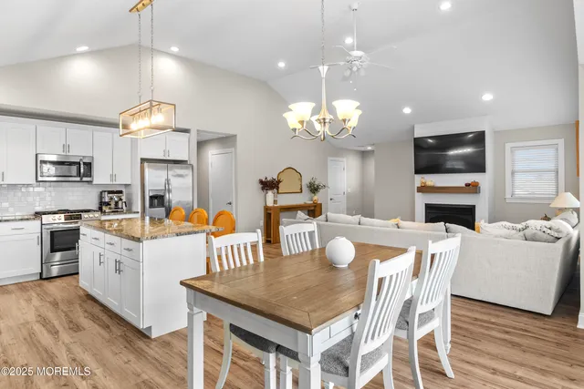 a living room with dining table furniture