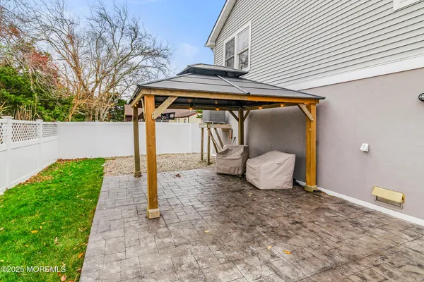 a view of a backyard with plants and lake view