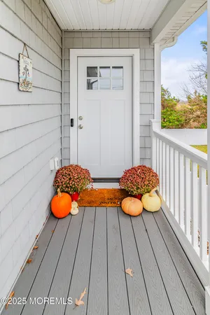 a view of a chairs and table on the balcony