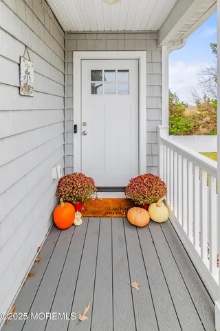 a view of a chairs and table on the balcony