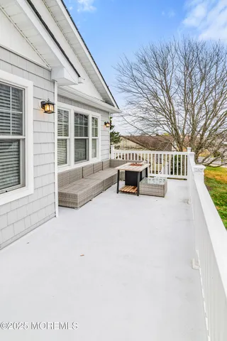 a view of a backyard with potted plants