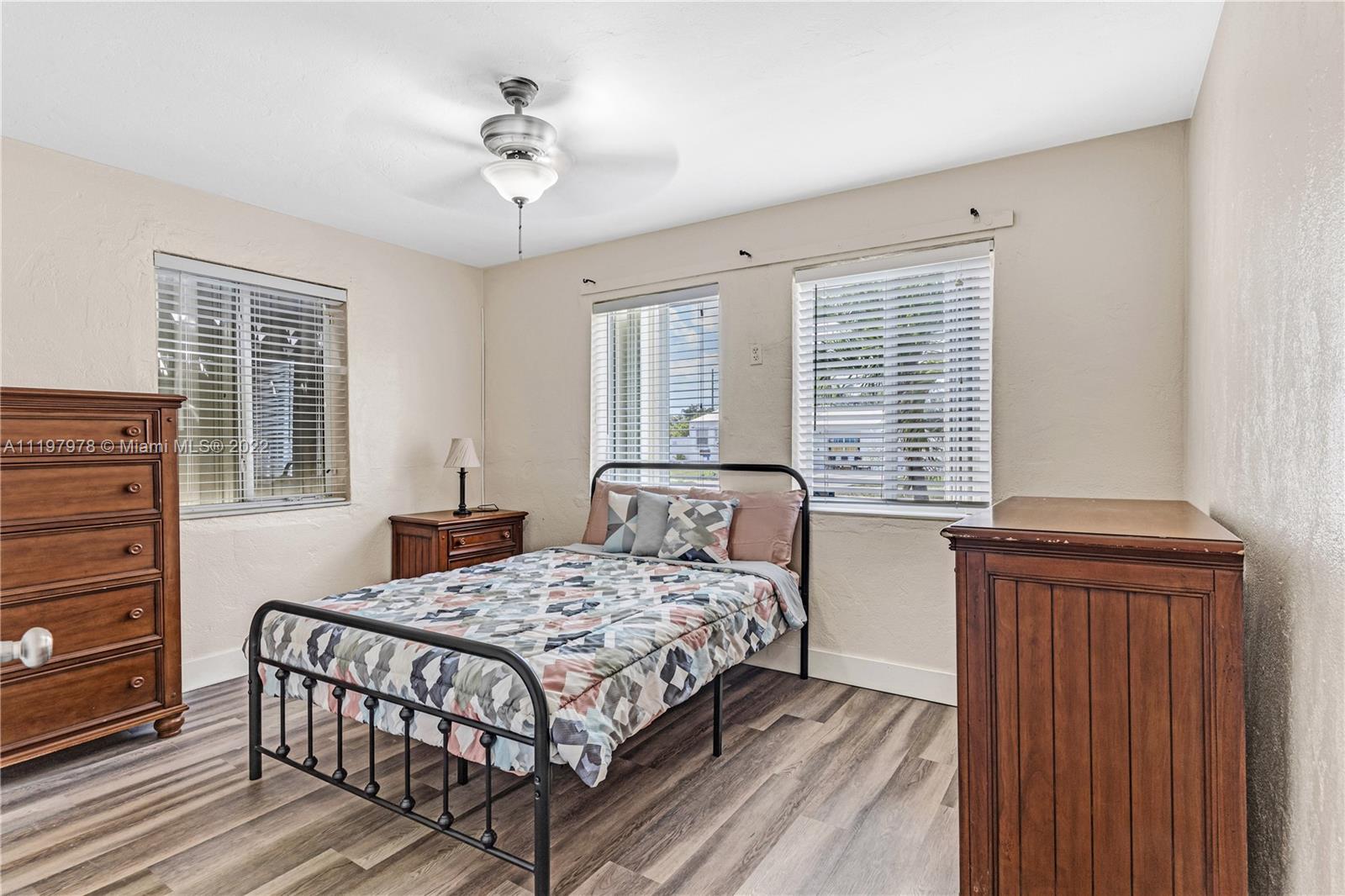 2123 Funston Street Hollywood, FL 33020 - Photo 12 of 30 a bedroom with a bed and windows