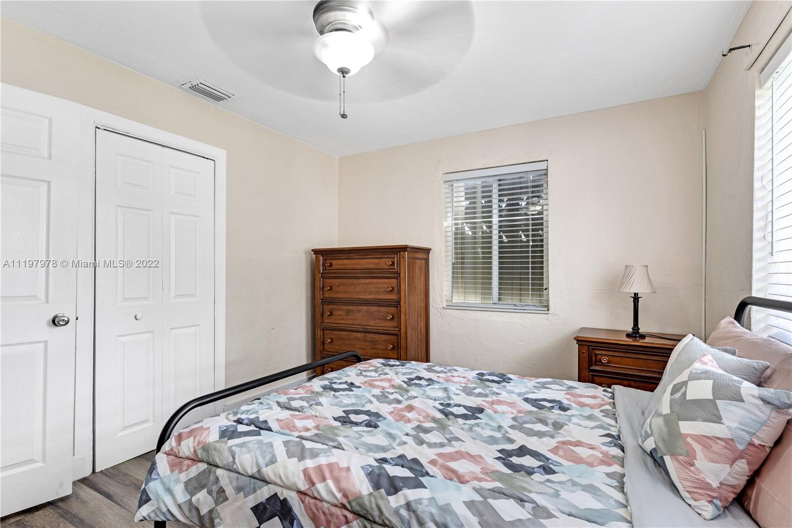 2123 Funston Street Hollywood, FL 33020 - Photo 13 of 30 a bedroom with a bed dresser and a window