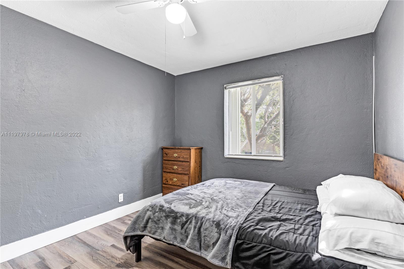 2123 Funston Street Hollywood, FL 33020 - Photo 14 of 30 a bedroom with a bed and a window