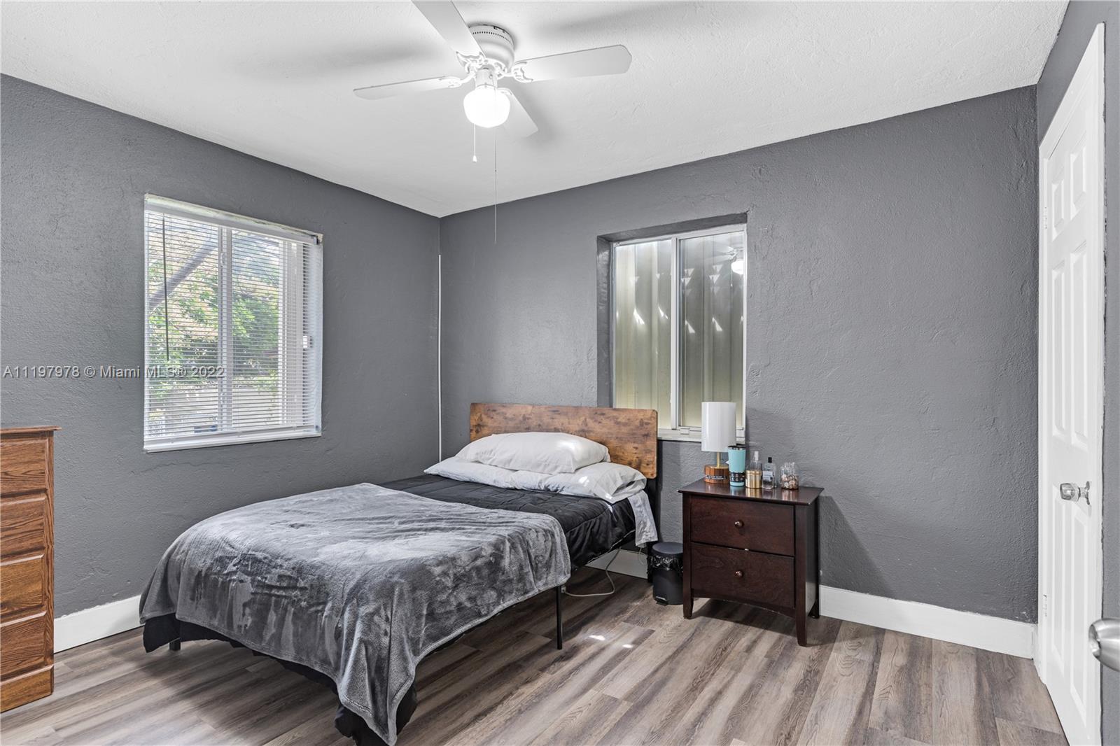 2123 Funston Street Hollywood, FL 33020 - Photo 15 of 30 a bedroom with a bed and a window