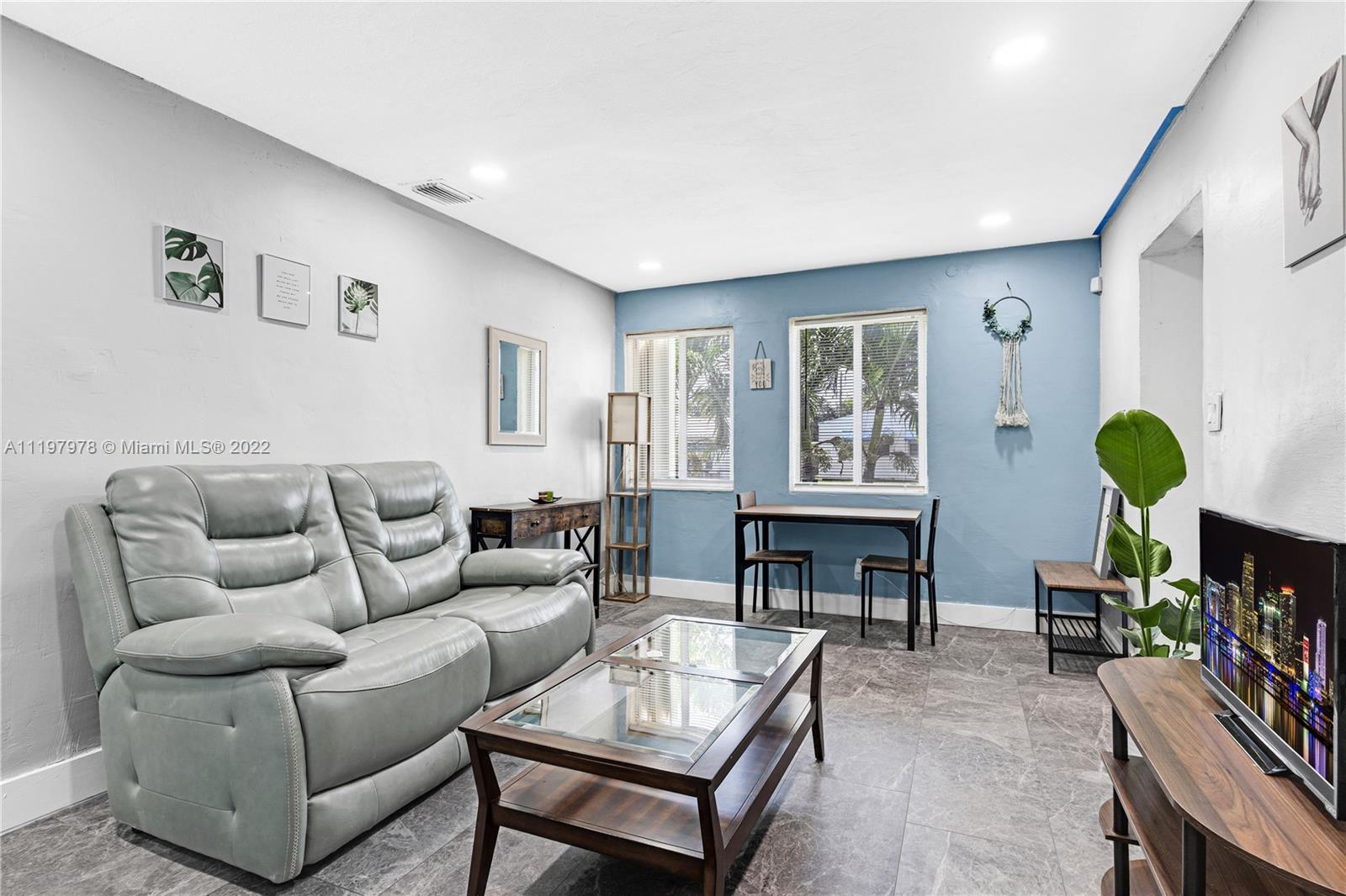 2123 Funston Street Hollywood, FL 33020 - Photo 2 of 30 a living room with furniture a fireplace and a window