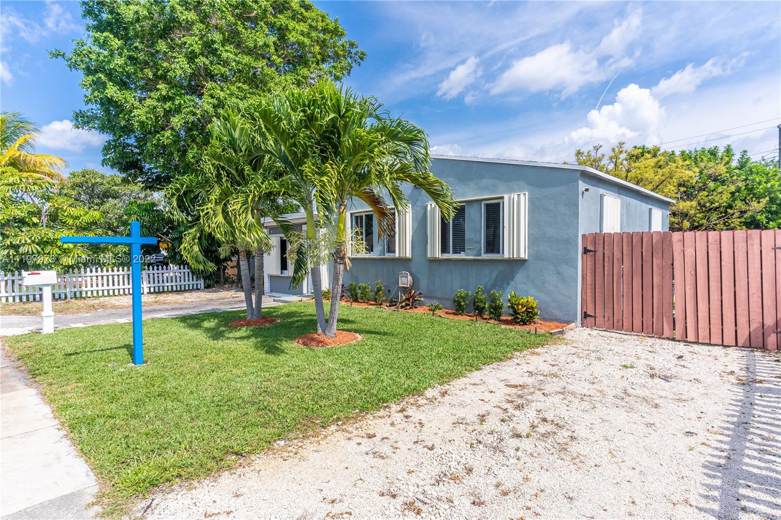 2123 Funston Street Hollywood, FL 33020 - Photo 29 of 30 a front view of house with garden
