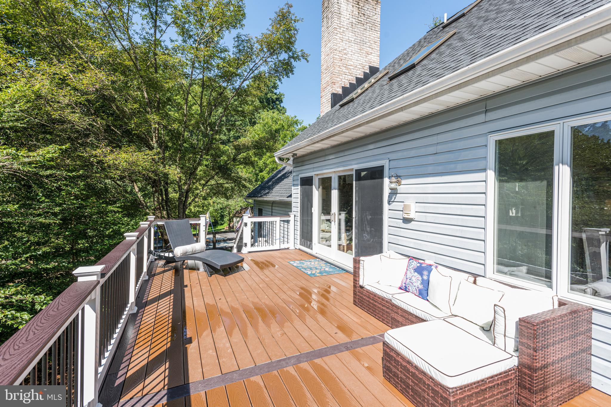 933 Monkton Road Monkton, MD 21111 - Photo 10 of 48 a view of a patio with a table and chairs