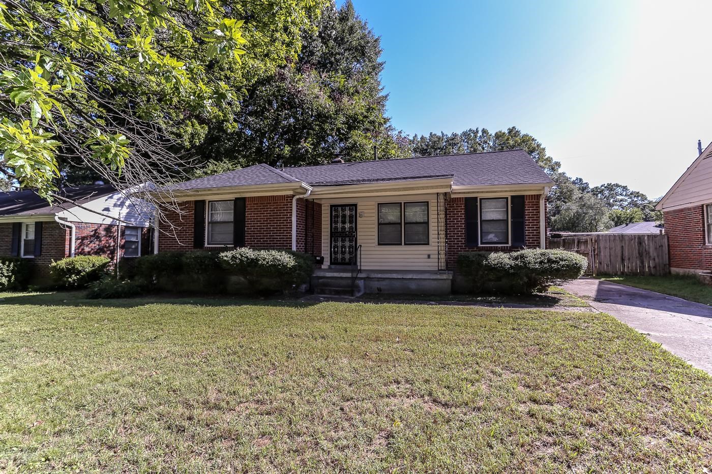 4705 Owen Road Memphis, TN 38122 - Photo 1 of 18 a front view of a house with a garden and porch