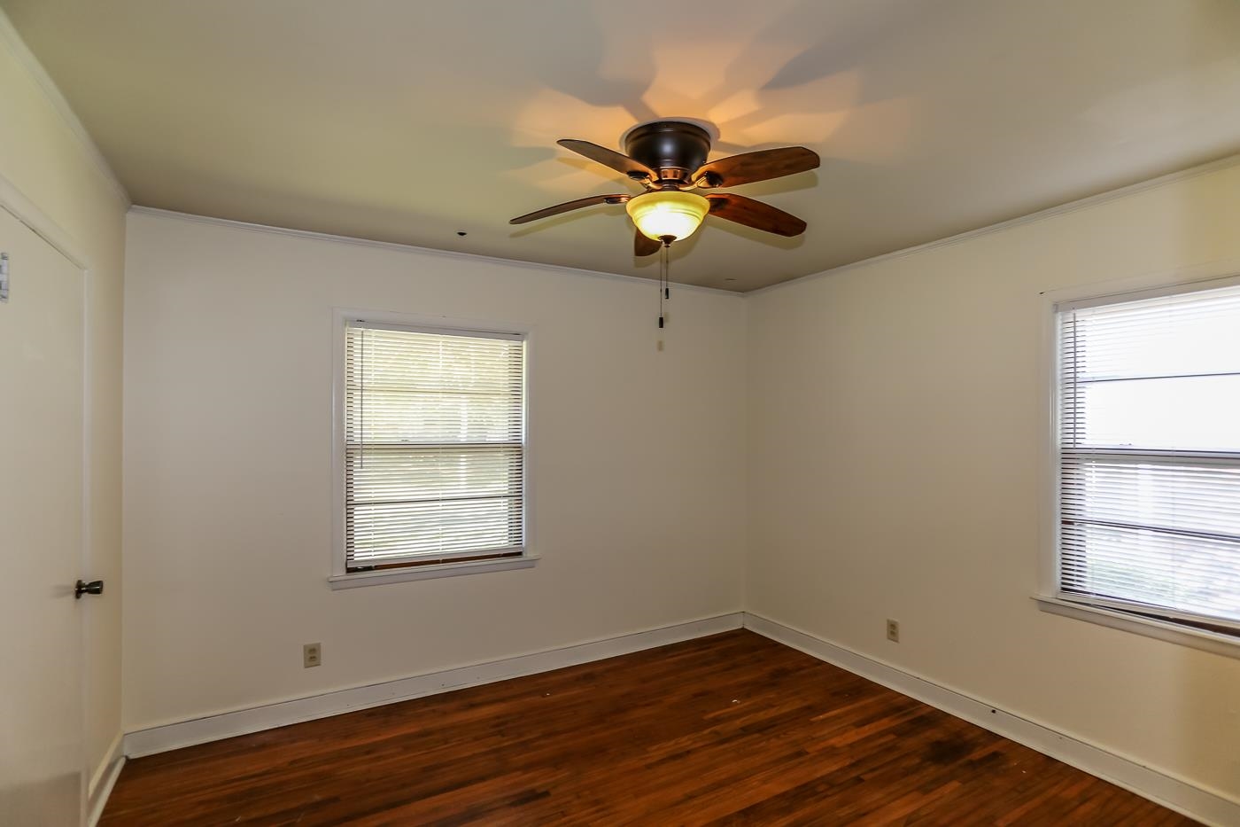 4705 Owen Road Memphis, TN 38122 - Photo 12 of 18 a view of an empty room with wooden floor and a window