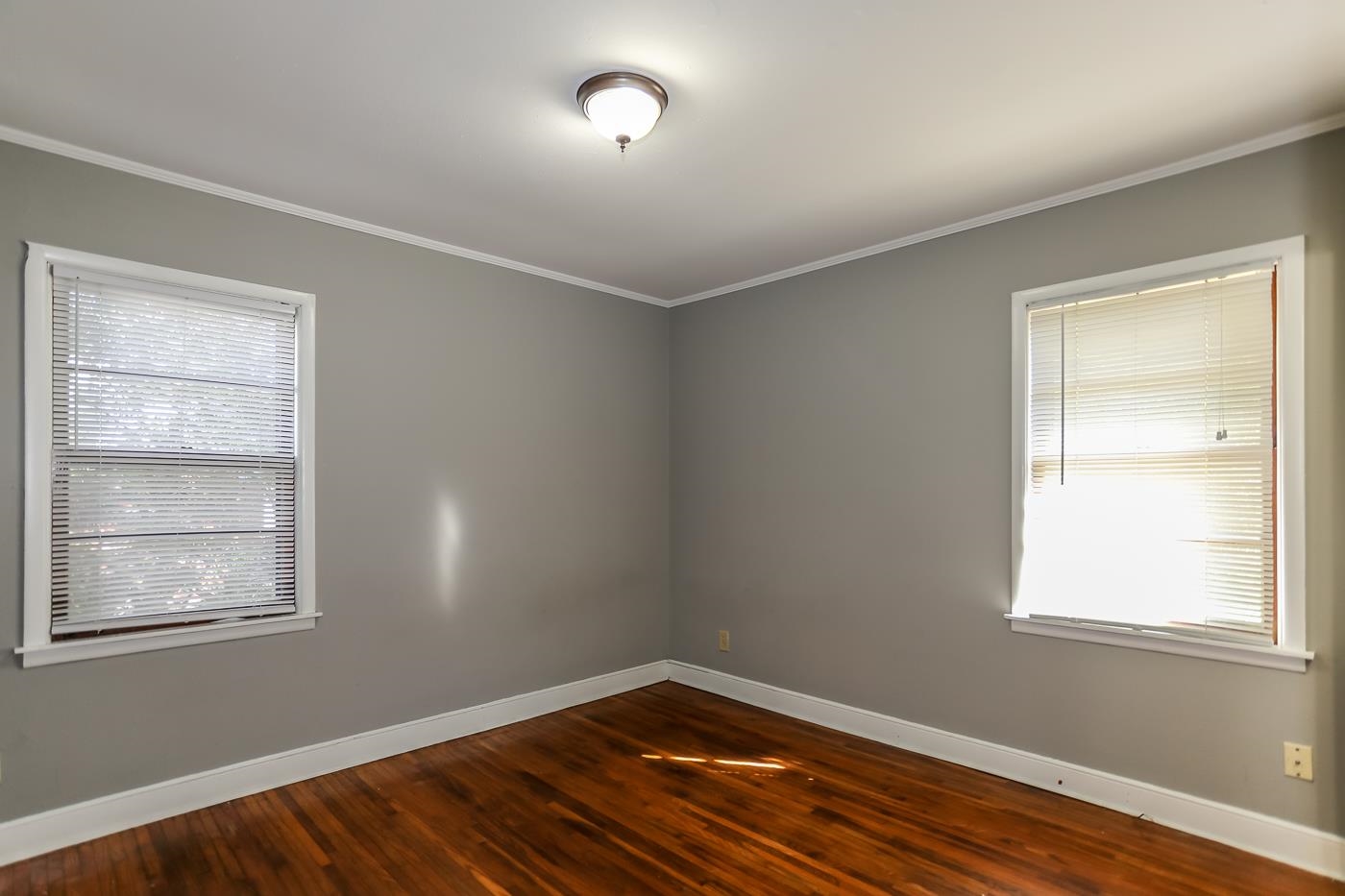 4705 Owen Road Memphis, TN 38122 - Photo 14 of 18 an empty room with wooden floor and windows