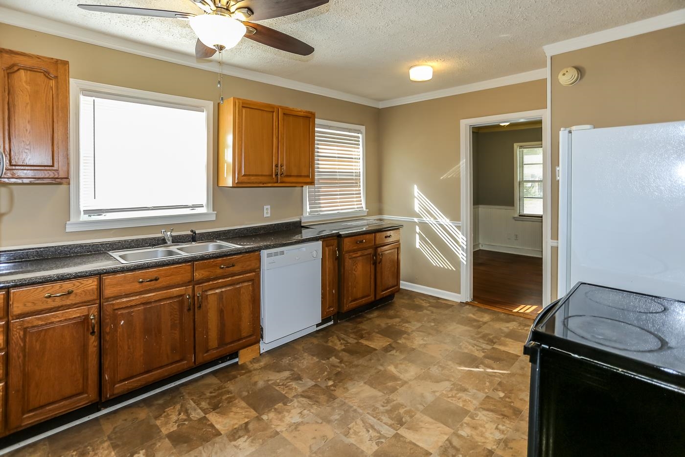 4705 Owen Road Memphis, TN 38122 - Photo 17 of 18 a kitchen with granite countertop a stove sink and cabinets