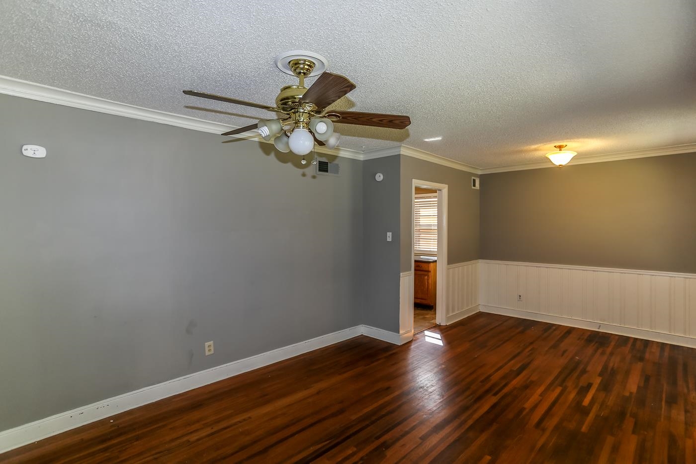 4705 Owen Road Memphis, TN 38122 - Photo 7 of 18 a view of a room with wooden floor and white walls