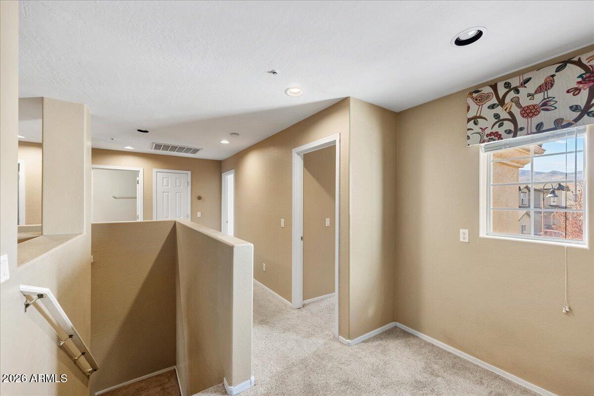 813 Alfonse Road Clarkdale, AZ 86324 - Photo 11 of 41 a view of a hallway with windows