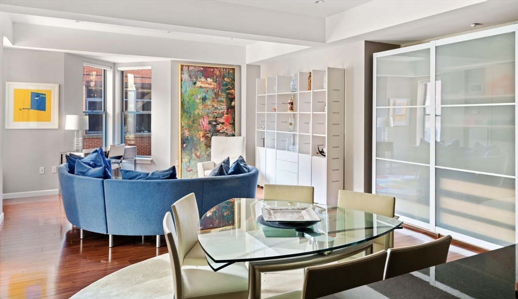 35 Fay Street, Unit 215 Boston, MA 02118 - Photo 2 of 14 a dining room with furniture and wooden floor