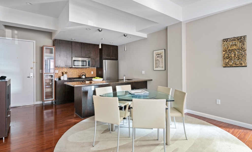 35 Fay Street, Unit 215 Boston, MA 02118 - Photo 5 of 14 a kitchen with a table and chairs