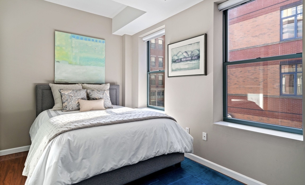 35 Fay Street, Unit 215 Boston, MA 02118 - Photo 7 of 14 a bedroom with a bed and a window
