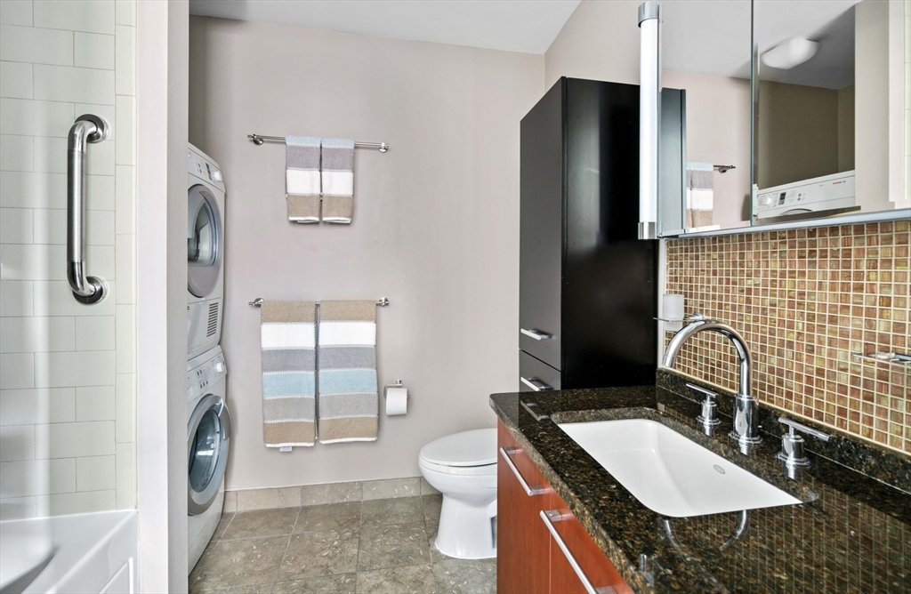 35 Fay Street, Unit 215 Boston, MA 02118 - Photo 8 of 14 a bathroom with a sink a toilet and shower