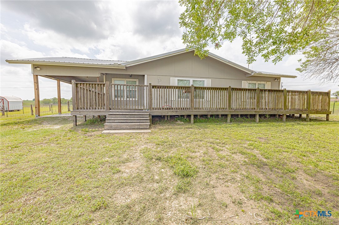 3300 State Highway 95 Shiner, TX 77984 - Photo 1 of 26 a view of a house with a yard and sitting area