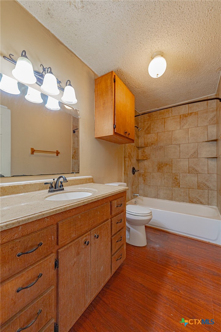 3300 State Highway 95 Shiner, TX 77984 - Photo 18 of 26 a bathroom with a double vanity sink and a mirror