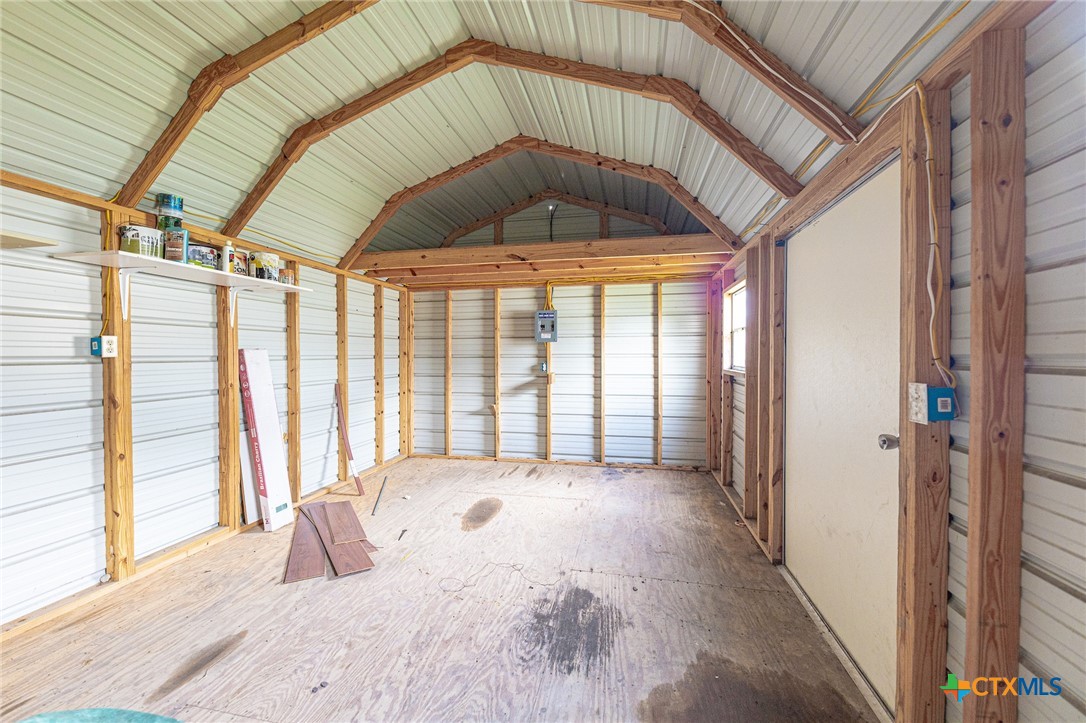 3300 State Highway 95 Shiner, TX 77984 - Photo 26 of 26 a bedroom with a bed and a large window