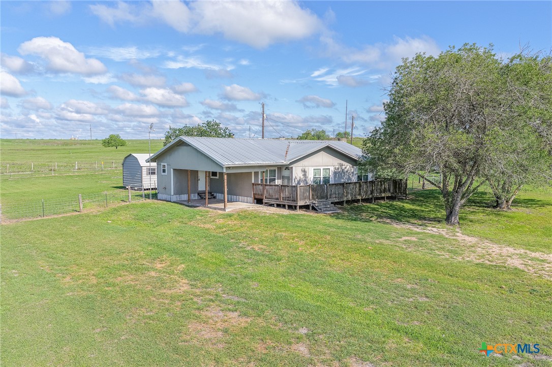 3300 State Highway 95 Shiner, TX 77984 - Photo 3 of 26 a front view of a house with garden