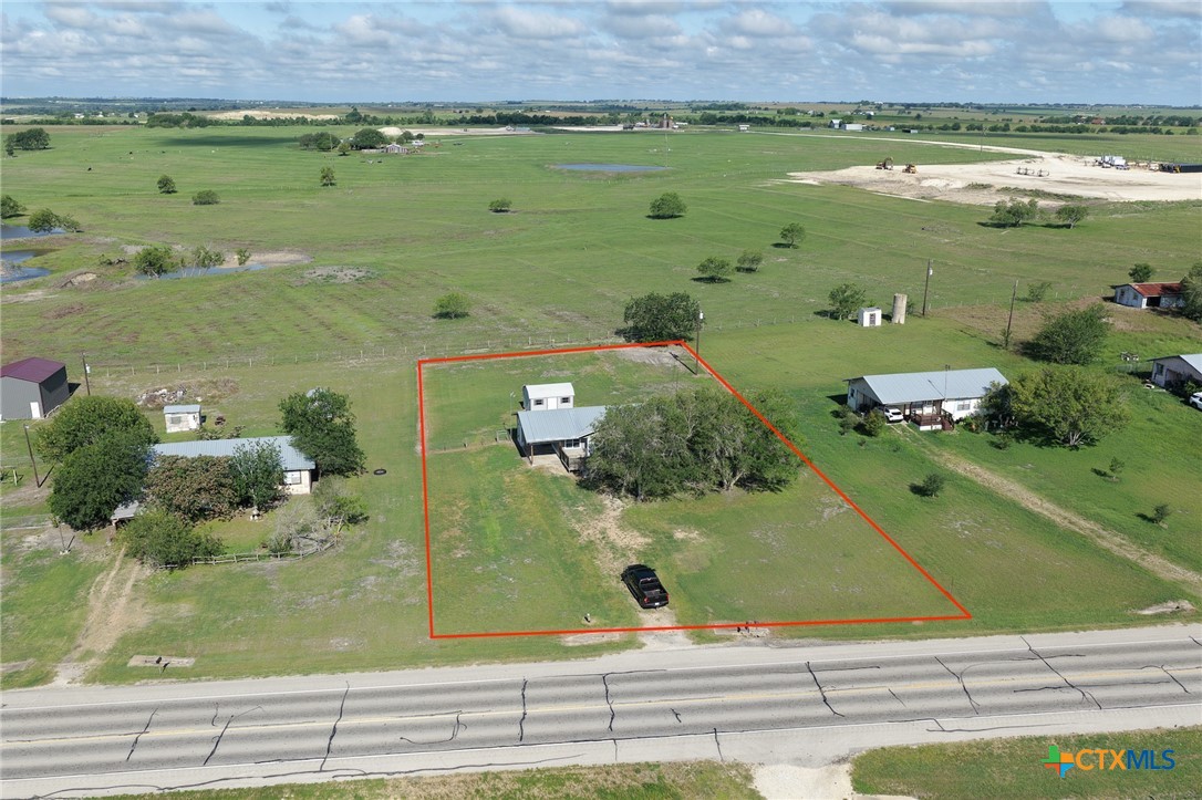 3300 State Highway 95 Shiner, TX 77984 - Photo 5 of 26 an aerial view of a residential houses with outdoor space and lake view