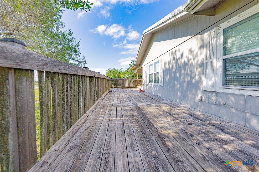 3300 State Highway 95 Shiner, TX 77984 - Photo 8 of 26 a view of backyard with wooden floor and fence